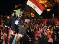 Tunisians, doubly jubilant after their own barely month-old victory pioneering- leaving- leader-  celebrating the latest candidate for resignation from power from the Egyptian embassy in Tunis.