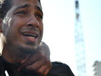 Tears for the suffering of his country- after years of frustration and pent up but erstwhile silent rage, this man is overwhelmed by the intensity as he opens the floodgate for tears of a nation united in emotion.