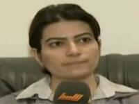 Making her mark as an investigator for the Libyan state: She subjected a state-arrested female Syrian journalist to an interrogation on her soliciting with the opposition forces.