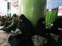 Iranian women read the Quran as they mark the 32nd anniversary of his return from exile at Khomeini's mausoleum in Tehran.