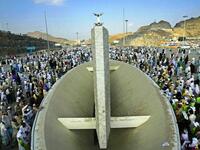 Taawaf-e-Afaza: First , another, or additional, circuit of the Ka’ba, then it's back to Mina for 3 or 4 days, 
stoning the pillars each day. Pilgrims by now can in theory step out of their pilgrim attire and 'state' of Ihram.