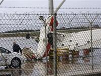 A damaged pilot training plane is pictured at the tarmac of Beirut international airport, as heavy winds topped 100 kilometres (60 miles) an hour.