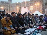 Tahrir Square prays as one hand
