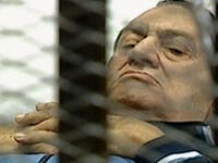 Mubarak on trial on a stretcher trolley