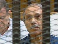 Egyptian former interior minister Habib al-Adly sits in a holding cell in the Cairo Criminal Court on the outskirt of the capital.