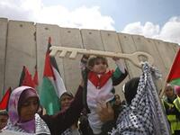 Rafah Raid : A Palestinian child holds a key made of wood, representing the key of her home snatched from her family during the creation of the state of Israel, at the Rafah border terminal between Egypt and the southern Gaza Strip, on May 15, 2011, during a rally to mark the Nakba.