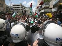 Hebron's Hope from the West Bank: Palestinian police block the street as protesters try and reach two Jewish settlements in the city of Hebron on May 15, 2011 as protests across fragmented West Bank were waged simultaneously against the Israeli frontiers, including Jenin and Ramallah.