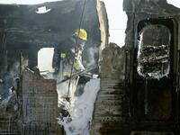 Israeli fire fighters are still trying to extinguish the flames of a burning train wreck.