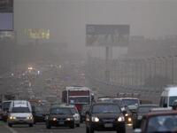 Cars drive amid fog covering Cairo. A sandstorm, strong winds and lashing rains swept across Egypt, closing several ports and disrupting traffic in the Suez Canal while at least three people died in a factory collapse in the Mediterranean city of Alexandria, officials said.