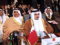 Crown Prince of Bahrain Sheikh Salman bin Hamad al-Khalifa (front) and Foreign Minister Sheikh Khalid bin Ahmed Al-Khalifa (2nd L).