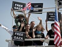 Still smiling, activists after 8/10 boats intercepted 2 weeks on from the sunny start. 2 remaining boats of aspiring
sea-farers, French ship the 'Dignity El Karameh' and the Swedish-Norwegian-Greek 'Juliano' still struggle, docked in the
Greek grip.