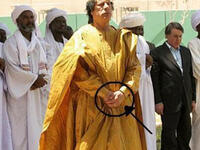 Another protocol botch: Holding his hands the incorrect wrong way round for Muslim prayer (should be right over left as the row of men behind demonstrate correctly)