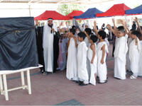 School kids perform the Hajj ritual in a show
