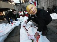 Syria protests with doctored pictures of Putin killing people