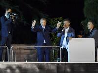 Turkish President Recep Tayyip Erdogan (C) waves to suppporters in Istanbul on June 24, 2018, during Turkey's presidential and parliamentary elections. Erdogan on June 24 declared victory in a tightly-contested presidential election. (AFP/ Bulent Kilic)
