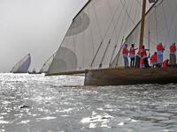 Emirati competitors sail their dhows as they take part in the Dalma Sailing Festival. (KARIM SAHIB / AFP)