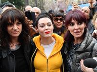 Rome -  Italian actress Asia Argento, left, along with U.S. actress Rose McGowan, center, who both accuse Harvey Weinstein of sexual assault, and Italian showgirl Miriana Trevisan, right, take part in a march organized by 'Non Una Di Meno' (Me too) movement. (AFP/Alberto Pizzoli)
