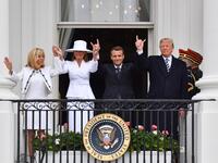 US President Donald Trump (R), French President Emmanuel Macron (2nd R), US First Lady Melana Trump (2nd L) and French First Lady Brigitte Macron are seen on the balcony at the White House in Washington, DC, on April 24, 2018. Nicholas Kamm / AFP