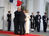 US President Donald Trump and First Lady Melania Trump greet French President Emmanuel Macron and his wife, Brigitte Macron, for a State Dinner at the White House in Washington, DC, April 24, 2018. 
ludovic MARIN / AFP