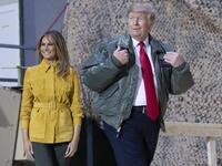 US President Donald Trump and First Lady Melania Trump arrive to speak to members of the US military during an unannounced trip to Al Asad Air Base in Iraq on December 26, 2018. SAUL LOEB / AFP