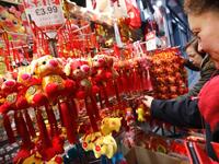 People look at festive New Year pig ornaments in the China Town area of London on February 5, 2019.
Tolga AKMEN / AFP