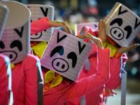 Performers wear pig costumes as they take part in the annual Lunar New Year parade in the Kowloon district of Hong Kong on February 5, 2019, to mark the Year of the Pig. 
Anthony WALLACE / AFP