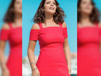 Mona sported a short red dress off shoulder dress for her latest photo shoot