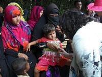 The high-level 15-member delegation of the UN Security Council talk to Rohingya refugees during their visit to Tombru in the Bangladeshi district of Bandarban on April 29, 2018. AFP