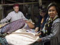 Abdelkader Ouazzani, the last of Morocco's brocade master weavers, displays tapestry at his workshop in the old city of Fez on April 10, 2019. His skilfull hands intricately create shimmering silk fabrics, enhanced with gold or silver thread, for bridal jewellery, designer creations or high-end furnishings. FADEL SENNA / AFP