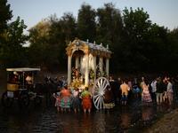 Pilgrims cross the Quema river in Villamanrique, during a pilgrimage on their way to the village of El Rocio. CRISTINA QUICLER / AFP