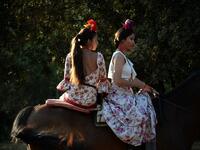 El Rocio pilgrimage, the largest in Spain, gathers hundreds of thousands of devotees in traditional outfits converging in a burst of colour as they make their way on horseback and on board decorated carriages across the Andalusian countryside. CRISTINA QUICLER / AFP
