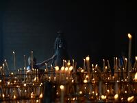 A pilgrim touches the effigy of the Rocio Virgin at the church of the village of El Rocio  CRISTINA QUICLER / AFP
