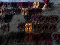 Footwear is seen as Buddhist monks, nuns, and members from the ultra-nationalist group Buddha Dhamma Parahita Foundation, previously known as Ma Ba Tha, attend the group's annual meeting in Yangon on June 17, 2019.  Ye Aung THU / AFP