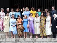 Japan's Prime Minister Shinzo Abe's wife Akie Abe (front C) poses with partners of the G20 leaders for a family photo during the G20 partners' programme at Tofuku-ji Temple in Kyoto on June 28, 2019.  DU Xiaoyi / POOL / AFP