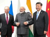 Russian President Vladimir Putin, Indian Prime Minister Narendra Modi and Chinese President Xi Jinping hold a meeting on the sidelines of the G20 summit in Osaka on June 28, 2019.  Mikhail KLIMENTYEV / SPUTNIK / AFP