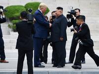 North Korea's leader Kim Jong Un shakes hands with US President Donald Trump north of the Military Demarcation Line that divides North and South Korea, in the Joint Security Area (JSA) of Panmunjom in the Demilitarized zone (DMZ) on June 30, 2019.  Brendan Smialowski / AFP