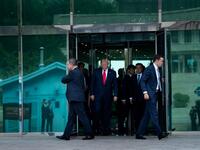 US President Donald Trump leaves Freedom House before walking to the line of demarcation to meet North Korea's leader Kim Jong-un in the Demilitarized Zone(DMZ) on June 30, 2019, in Panmunjom, Korea.  Brendan Smialowski / AFP