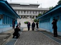 North Korea's leader Kim Jong Un stands with US President Donald Trump north of the Military Demarcation Line that divides North and South Korea, in the Joint Security Area (JSA) of Panmunjom in the Demilitarized zone (DMZ) on June 30, 2019.  Brendan Smialowski / AFP