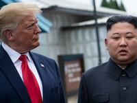 US President Donald Trump and North Korea's leader Kim Jong-un talk before a meeting in the Demilitarized Zone (DMZ) on June 30, 2019, in Panmunjom, Korea.  Brendan Smialowski / AFP