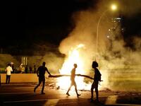 Israeli members of the Ethiopian community block a road in the coastal city of Netanya, to protest the killing of Solomon Tekah, a young man of Ethiopian origin who was killed by an off-duty police officer.  JACK GUEZ / AFP