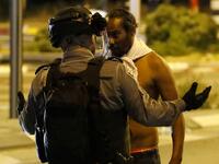 Crowds of Ethiopian Israelis battled police and blocked highways on at least 15 junctions across the country, with 47 officers wounded and 60 demonstrators detained, according to a police statement.  JACK GUEZ / AFP