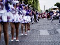 People parade during the Tropical Carnival on July, 7 2019 in Paris.  Kenzo TRIBOUILLARD / AFP