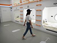 A woman "Mars Base 1", a C-Space Project, in the Gobi desert, some 40 kilometres from Jinchang in China's northwest Gansu province on April 17, 2019. WANG ZHAO / AFP