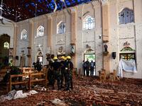 Security personnel inspect the interior of St Sebastian's Church in Negombo on April 22, 2019, a day after the church was hit in series of bomb blasts targeting churches and luxury hotels in Sri Lanka. Jewel SAMAD / AFP