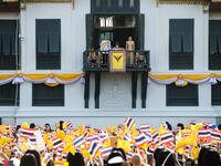 Thailand's King Maha Vajiralongkorn and Queen Suthida appear on the balcony of Suddhaisavarya Prasad Hall of the Grand Palace as they grant a public audience on the final day of his royal coronation in Bangkok on May 6, 2019.  Jewel SAMAD / AFP