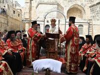 Greek Orthodox Patriarch of Jerusalem, Theophilos III (C), leads the traditional Washing of the Feet ceremony in front of the church of the Holy Sepulchre in Jerusalem's Old City, on April 25, 2019, as part of the Orthodox Holy Week celebrations.  GALI TIBBON / AFP