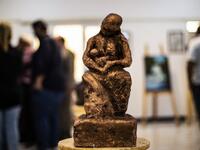 Sunlight floods into a brand new library at the cultural centre where books line shelves along a wall that still smells of wet paint. DELIL SOULEIMAN / AFP