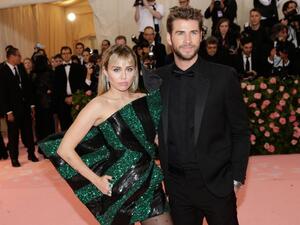 Miley Cyrus L pictured with Liam Hemsworth voiced her love for Hemsworth on their 10 year anniversary as a couple File Photo by John Angelillo UPI License Photo