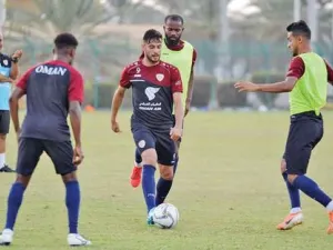 Oman striker Abdulaziz al Miqbali (centre) and defender Mohammed al Mussalami (right) at a training session
