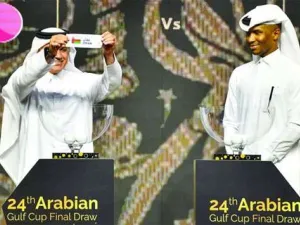 Former Qatari football captains Adel Malallah (L) and Belal Mohamed conduct the draw for the 24th Arabian Gulf Cup at the Marsa Malaz Kempinski, The Pearl – Doha on Wednesday.